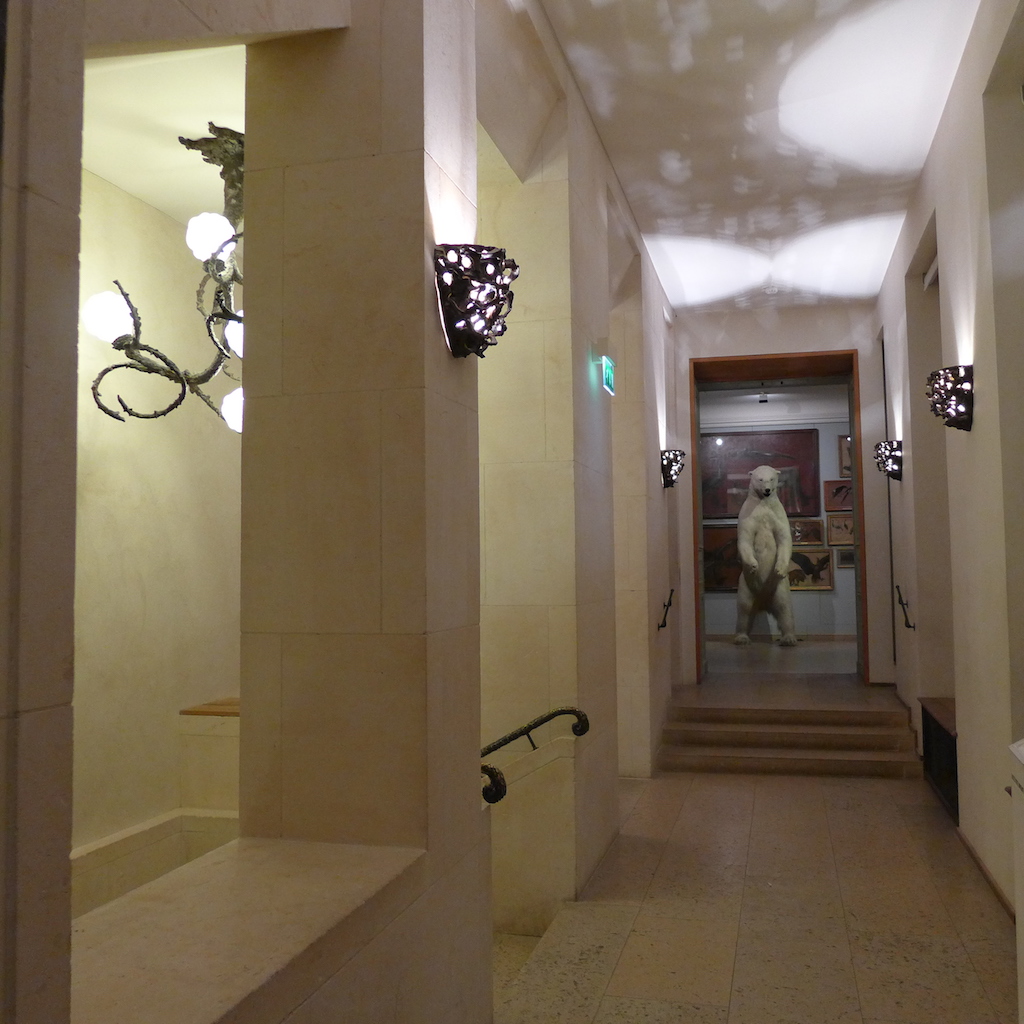 At the end of the corridor on the first floor